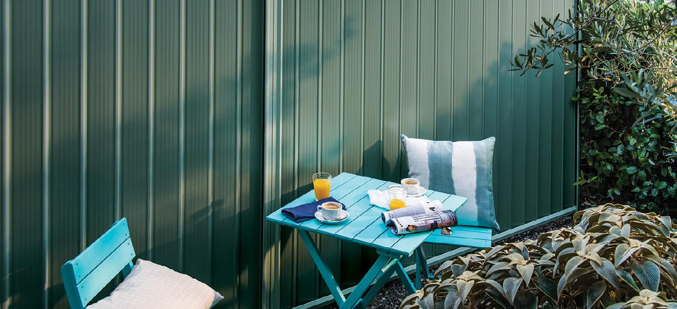 Outdoor table with coffee and orange juice.